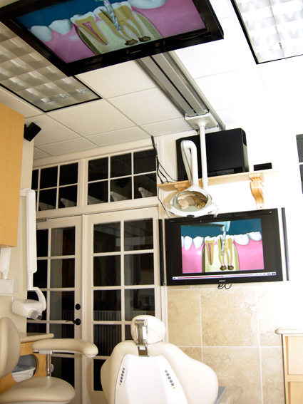 interior of office with wide screen televisions
